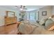 A well-lit main bedroom showcases a bay window and traditional furnishings at 121 Woodland Dr, Summerville, SC 29485