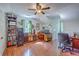 Spacious home office with hardwood flooring, multiple desks, and decorative shelving at 121 Woodland Dr, Summerville, SC 29485
