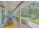 Cozy covered porch with rocking chairs, offering a relaxing outdoor space with a neighborhood view at 121 Woodland Dr, Summerville, SC 29485