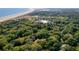 Scenic aerial view of a property near the beach, surrounded by lush greenery and stunning coastline views at 1355 Dunlin Ct # Share D, Kiawah Island, SC 29455