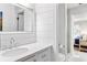 Modern bathroom with stylish marble countertops, a framed mirror, and bright lighting at 1355 Dunlin Ct # Share D, Kiawah Island, SC 29455