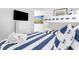 Cozy bedroom with nautical-themed decor, bunk beds, and a comfortable bed at 1355 Dunlin Ct # Share D, Kiawah Island, SC 29455