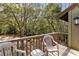 Outdoor deck featuring chairs with a view of lush trees and foliage, perfect for relaxation and enjoying nature at 1355 Dunlin Ct # Share D, Kiawah Island, SC 29455