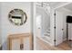 Inviting entryway with wood-look floors, board and batten accent wall, and decorative mirror at 1355 Dunlin Ct # Share D, Kiawah Island, SC 29455