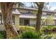 Inviting home with a charming porch area, beautifully framed by lush trees and shrubs, enhancing curb appeal at 1355 Dunlin Ct # Share D, Kiawah Island, SC 29455