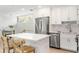 Well-lit modern kitchen with stainless steel appliances and white cabinets at 1355 Dunlin Ct # Share D, Kiawah Island, SC 29455