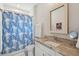 Bathroom featuring a vanity with a granite countertop, and a shower with a blue, patterned curtain at 137 Bratton Cir, Mount Pleasant, SC 29464