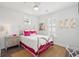 Bright bedroom with silver bed frame, pink accents, and plenty of natural light through shuttered windows at 137 Bratton Cir, Mount Pleasant, SC 29464