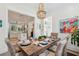 Bright dining room with wooden table and seating adjacent to a modern kitchen and living area at 137 Bratton Cir, Mount Pleasant, SC 29464