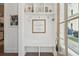 Bright entryway featuring white walls, built-in shelves, a wooden bench, and stylish decor at 137 Bratton Cir, Mount Pleasant, SC 29464
