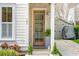 Inviting front entrance featuring a glass-paneled wood door and manicured landscaping at 137 Bratton Cir, Mount Pleasant, SC 29464