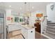 Open kitchen featuring white cabinetry, marble countertops, stainless steel appliances, and a center island at 137 Bratton Cir, Mount Pleasant, SC 29464