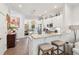 Bright, open kitchen with eat-in bar, white cabinets, marble countertops, and stainless steel appliances at 137 Bratton Cir, Mount Pleasant, SC 29464