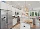 Bright kitchen with white cabinets, stainless steel appliances, marble countertops, and decorative accents at 137 Bratton Cir, Mount Pleasant, SC 29464
