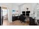 Office featuring a large desk, dual monitors, and natural light from large, shuttered windows at 137 Bratton Cir, Mount Pleasant, SC 29464
