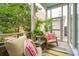 Relaxing screened patio features comfortable seating and lush greenery at 137 Bratton Cir, Mount Pleasant, SC 29464