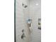 Bright shower with white subway tile, chrome fixtures, and built-in niche shelving for toiletries at 137 Bratton Cir, Mount Pleasant, SC 29464