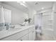 Clean bathroom featuring a shower, vanity, and a well-lit mirror at 1387 Thin Pine Dr, Johns Island, SC 29455