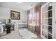 Bright bedroom featuring a vanity area, natural light, a fur rug, and soft pink accents at 1387 Thin Pine Dr, Johns Island, SC 29455