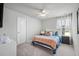 Bright bedroom with a ceiling fan, bedside tables with lamps, and stylish bedding at 1387 Thin Pine Dr, Johns Island, SC 29455