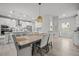 Open dining and kitchen area with ample seating and stylish pendant lighting overhead at 1387 Thin Pine Dr, Johns Island, SC 29455