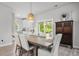 Dining area features a wood table, upholstered chairs, and a view to the backyard at 1387 Thin Pine Dr, Johns Island, SC 29455