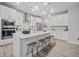 Bright kitchen features white cabinetry, an island with bar seating, and stainless steel appliances at 1387 Thin Pine Dr, Johns Island, SC 29455