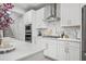 Modern kitchen with stainless steel appliances, white cabinetry and plenty of counter space at 1387 Thin Pine Dr, Johns Island, SC 29455