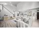 Bright living room showcasing an open concept with lots of natural light and wood flooring at 1387 Thin Pine Dr, Johns Island, SC 29455
