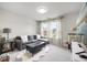 Cozy living room with a comfortable sectional sofa, plush rug, and large windows for natural light at 1387 Thin Pine Dr, Johns Island, SC 29455