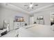 Spacious main bedroom with a ceiling fan, white dresser, TV, and soft neutral colors at 1387 Thin Pine Dr, Johns Island, SC 29455