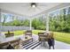 Inviting covered patio with comfortable seating, ceiling fan, and view of the backyard at 1387 Thin Pine Dr, Johns Island, SC 29455