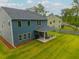 Beautiful backyard showcasing the home's rear exterior, covered patio, and expansive lawn at 1387 Thin Pine Dr, Johns Island, SC 29455