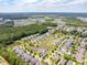Wide aerial view of a neighborhood with a community pond, and mature trees at 1446 Crane Creek Dr, Mount Pleasant, SC 29466