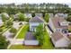 Aerial shot of a lovely home with a lush green lawn and mature trees in a peaceful neighborhood at 1446 Crane Creek Dr, Mount Pleasant, SC 29466