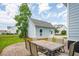 Cozy patio with an outdoor dining set and detached garage at 1446 Crane Creek Dr, Mount Pleasant, SC 29466