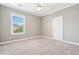Bright bedroom featuring a large window, neutral walls, and a large closet at 1446 Crane Creek Dr, Mount Pleasant, SC 29466