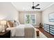 Bright bedroom features a ceiling fan, window, and dresser at 1446 Crane Creek Dr, Mount Pleasant, SC 29466