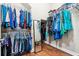 Walk-in closet with ample hanging space, shelving, mirror, and wood floor at 1446 Crane Creek Dr, Mount Pleasant, SC 29466