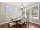 Elegant dining room with wood table, upholstered chairs, and natural lighting at 1446 Crane Creek Dr, Mount Pleasant, SC 29466
