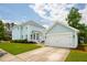 Charming two-story home with attached garage and well-maintained lawn on a beautiful sunny day at 1446 Crane Creek Dr, Mount Pleasant, SC 29466