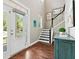 Inviting foyer featuring hardwood floors, staircase, and lots of natural light at 1446 Crane Creek Dr, Mount Pleasant, SC 29466