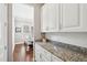 Kitchen area featuring white cabinets, stainless steel appliances, and granite countertops at 1446 Crane Creek Dr, Mount Pleasant, SC 29466