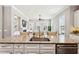 Spacious kitchen with granite counters and stainless steel dishwasher opens to the living room at 1446 Crane Creek Dr, Mount Pleasant, SC 29466