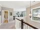 Upstairs landing with carpet floor, study in the distance, and natural light at 1446 Crane Creek Dr, Mount Pleasant, SC 29466