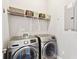 Laundry room featuring front loading washer and dryer and shelf for storage baskets at 1446 Crane Creek Dr, Mount Pleasant, SC 29466