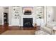 Living room includes a fireplace with built-in shelving and a mounted TV at 1446 Crane Creek Dr, Mount Pleasant, SC 29466