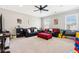 Spacious living room with ample natural light, comfortable seating, and a ceiling fan at 1446 Crane Creek Dr, Mount Pleasant, SC 29466