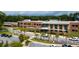 Exterior view of a modern brick school building with lush green landscaping at 1446 Crane Creek Dr, Mount Pleasant, SC 29466