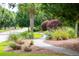 Scenic walking path with bench seating surrounded by lush landscaping at 1446 Crane Creek Dr, Mount Pleasant, SC 29466